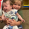 Sophia is registered to the contest to win money with this photo: baby, child, smile, hug, carpet, clothing, toy, indoor, person, cute, happy, sitting, holding, toddler, playroom, family, candid, portrait, caucasian, casual