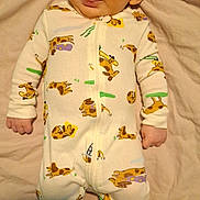 Kaspian joined the competition — help win amazing prizes! baby, infant, smiling, onesie, dog_pattern, blanket, cute, tongue_out, sleepwear, lying_down, child, soft_texture, happy, young_child, indoors, person, portrait, face, cozy, sleeping_area