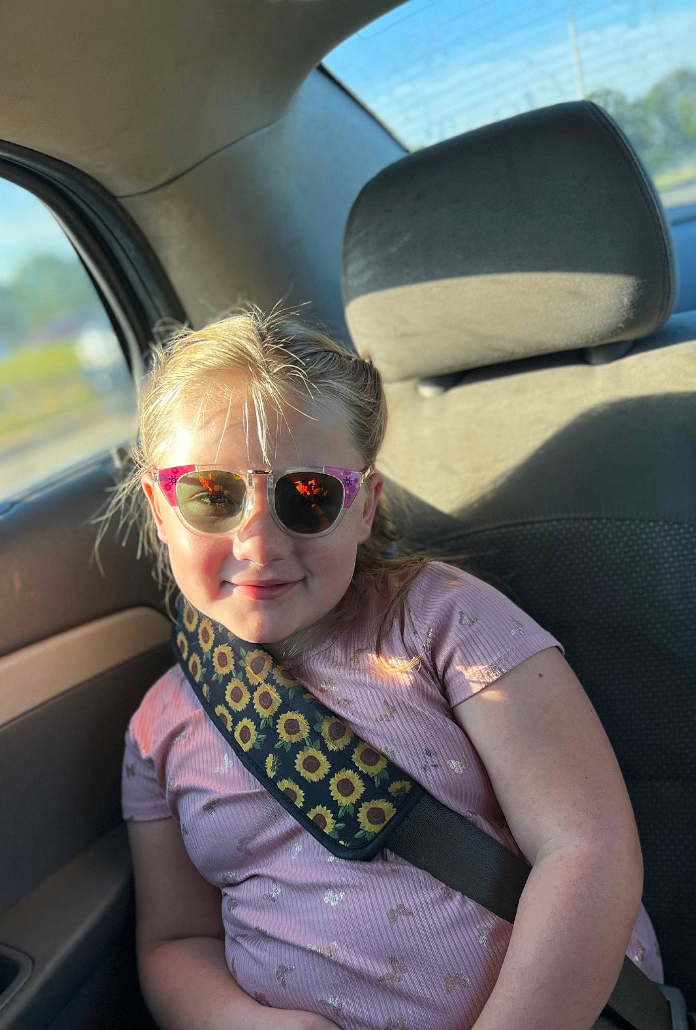 Gracelyn is registered to the contest to win money with this photo: auto_part, automotive_design, automotive_exterior, car, car_seat, car_seat_cover, dress, eyewear, glasses, goggles, head_restraint, joy, motor_vehicle, person, personal_luxury_car, sky, smile, summer, sunglasses, vehicle