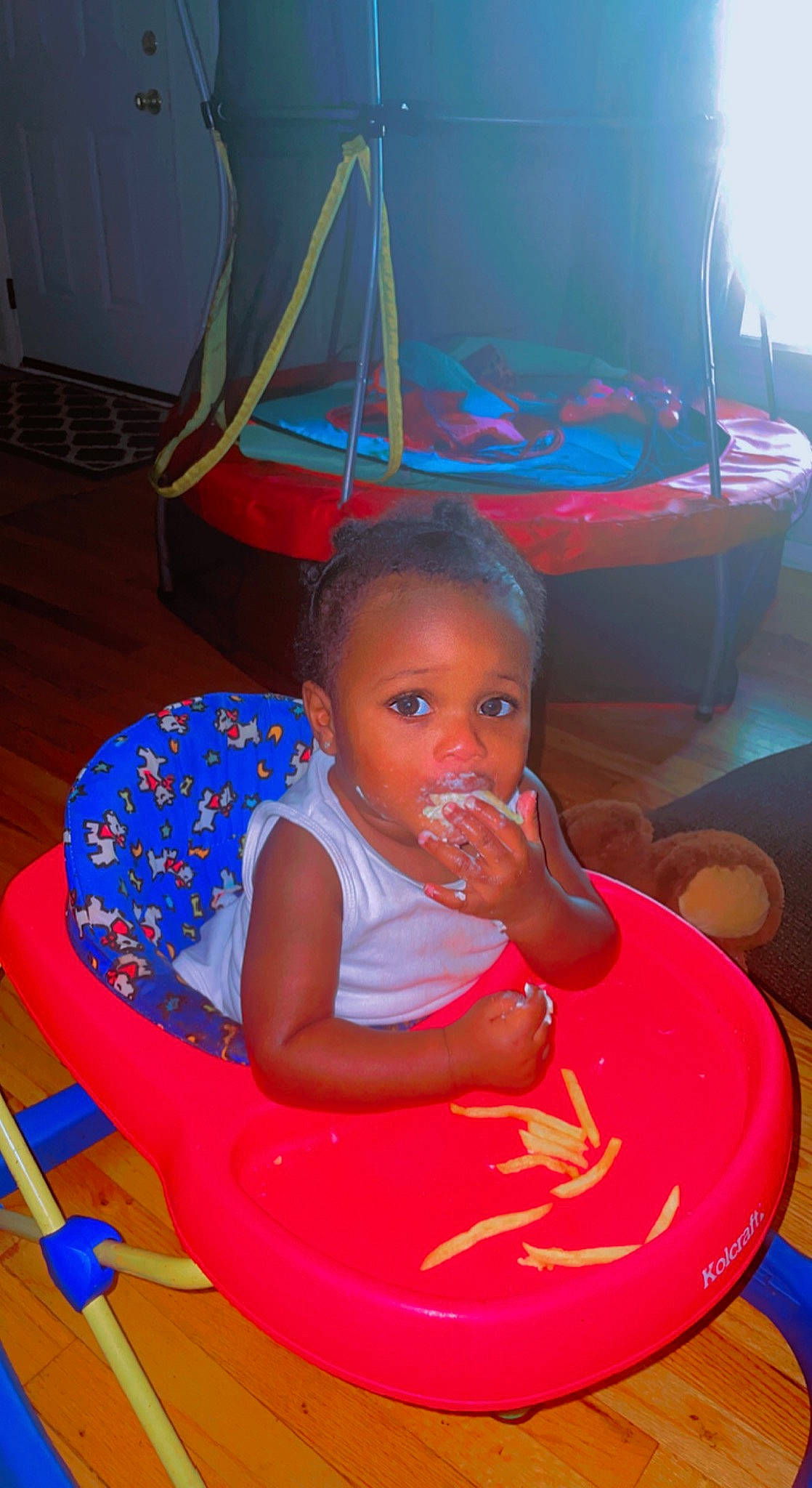 Jamir is registered to the contest to win money with this photo: baby, baby_toddler_clothing, bib, chair, child, event, flooring, food, fun, lap, leisure, magenta, person, plate, play, room, sitting, table, tableware, toddler