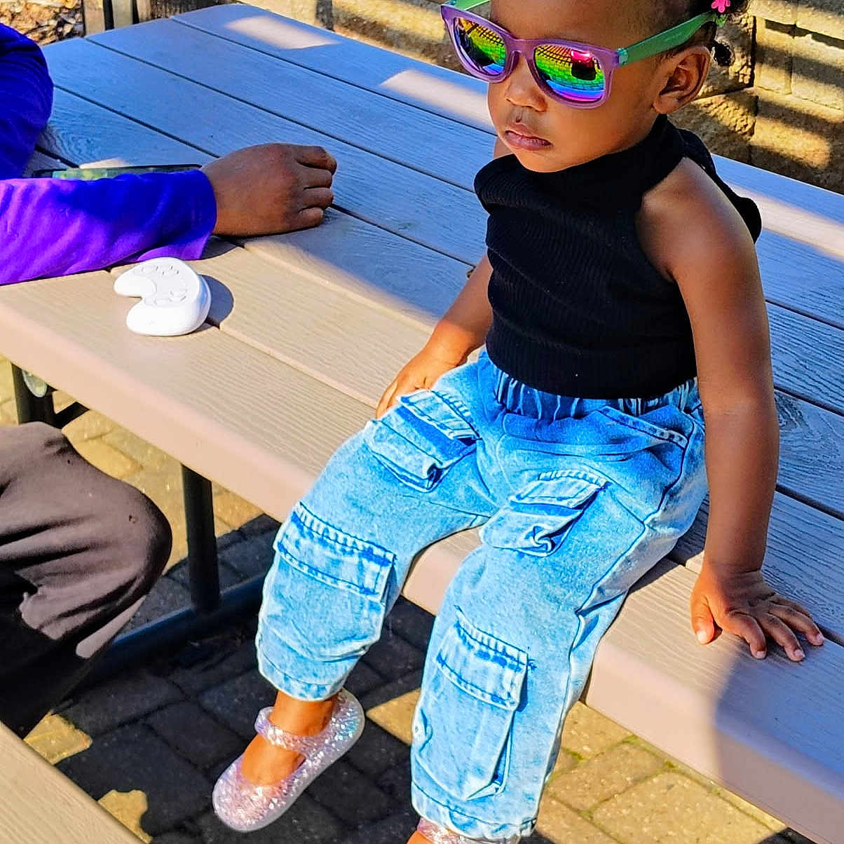 Lamara is registered to the contest to win money with this photo: accessories, boy, child, clothing, face, female, footwear, furniture, girl, head, jeans, male, pants, person, photography, portrait, shoe, sitting, sunglasses, table