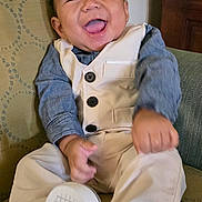 Zixton joined the competition — help win amazing prizes! baby, child, smiling, happy, sitting, clothing, vest, pants, shirt, shoes, footwear, indoor, furniture, chair, pattern, cute, portrait, infant, person, fun