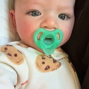 Axel joined the competition — help win amazing prizes! baby, pacifier, onesie, cookie_pattern, milk_carton_pattern, infant, close_up, face, child, cute, soft_fabric, sleepwear, indoor, comfort, head, expression, skin, person, young, resting
