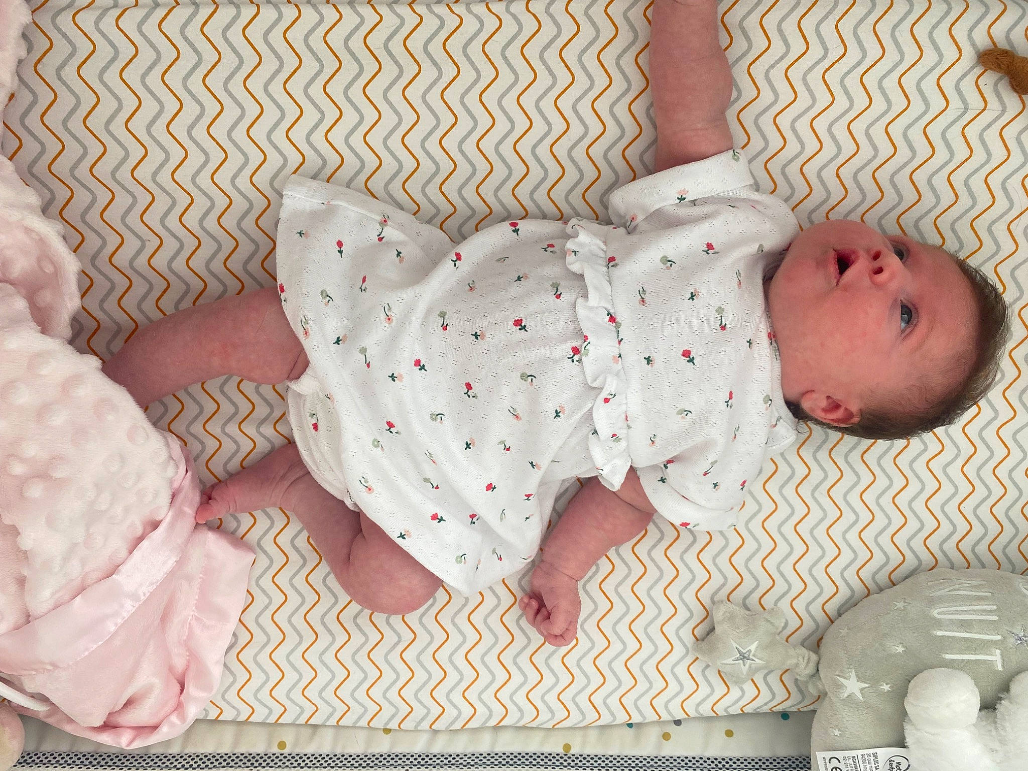 Mya participe au concours pour gagner de l'argent avec cette photo : arm, baby, baby_products, baby_safety, baby_sleeping, baby_toddler_clothing, bed, bedding, bedtime, child, comfort, human_body, infant_bed, linens, pattern, person, pink, room, sleeve, textile