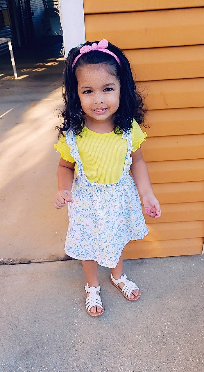 Neela joined the competition — help win amazing prizes! baby_toddler_clothing, chin, dress, eye, face, footwear, hair, hairstyle, happy, head, human_body, joy, person, pink, skin, sleeve, smile, standing, toddler, waist