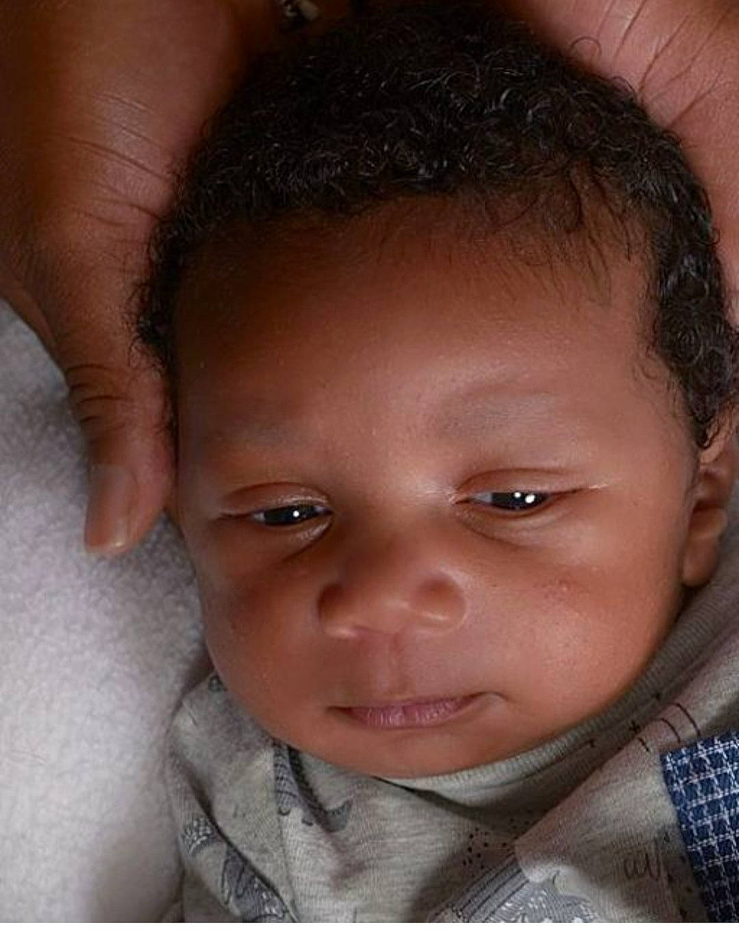 Clifton is registered to the contest to win money with this photo: baby, baby_toddler_clothing, cheek, child, collar, ear, eyebrow, eyelash, flash_photography, forehead, happy, lip, no_expression, nose, person, portrait_photography, skin, sleeve, toddler