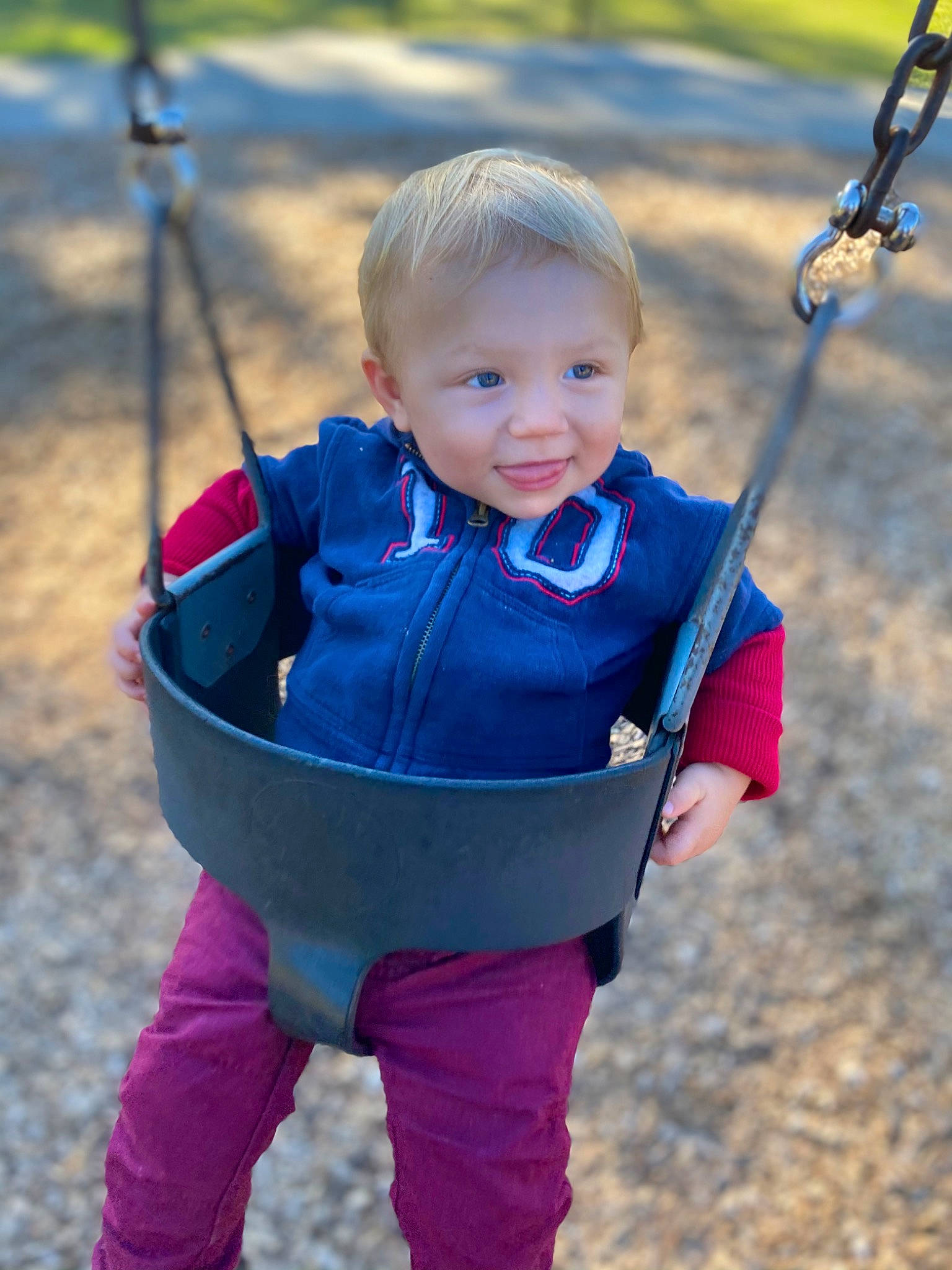 Liam joined the competition — help win amazing prizes! baby, baby_toddler_clothing, blue, cheek, child, cobalt_blue, cool, electric_blue, facial_expression, fun, human_settlement, outdoor_play_equipment, people_in_nature, person, play, playground, product, public_space, summer, swing