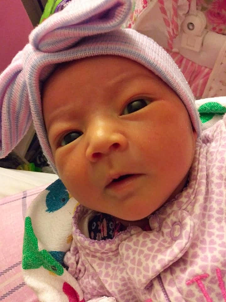 Ariyona is registered to the contest to win money with this photo: baby, cheek, child, close_up, eye, face, head, headgear, headwear, lip, mouth, nose, person, pink, skin, smile, toddler