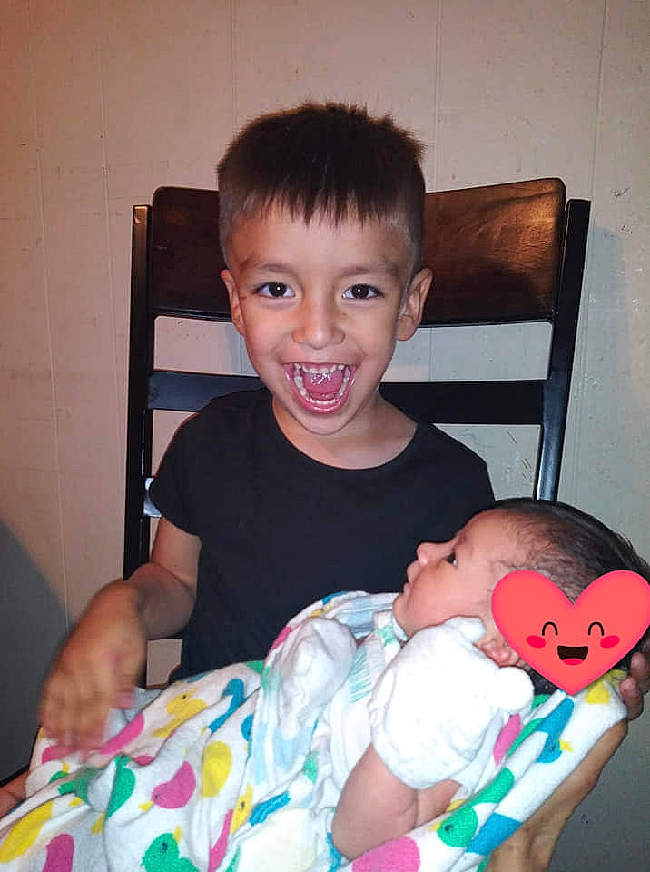 Ariyona is registered to the contest to win money with this photo: arm, baby, child, finger, joy, person, play, toddler