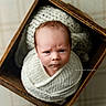 Caden is registered to the contest to win money with this photo: baby, blanket, child, close_up, cozy, cream_color, eyes, face, indoor, infant, newborn, photography, portrait, safe, serious_expression, soft_lighting, textile, vintage, wooden_box, wrapped