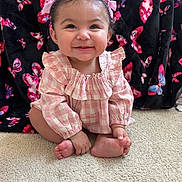 Rosemarie joined the competition — help win amazing prizes! baby, child, smiling, pink_bows, pink_outfit, checkered_clothing, carpet, butterfly_pattern, black_blanket, happy, cute, portrait, indoor, sitting, infant, toes, long_sleeves, hair_bows, cheerful, adorable