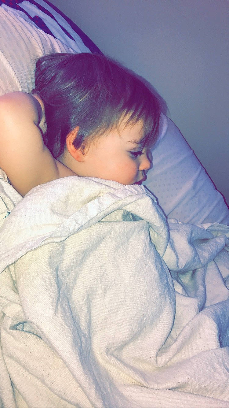 Jaxon is registered to the contest to win money with this photo: arm, baby, bed, bedtime, cheek, child, comfort, eye, forehead, joint, nap, nose, person, skin, sleep, toddler