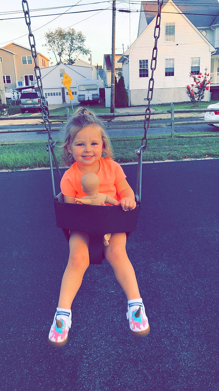 Savannah is registered to the contest to win money with this photo: child, fun, joy, outdoor_play_equipment, person, play, playground, smile, swing