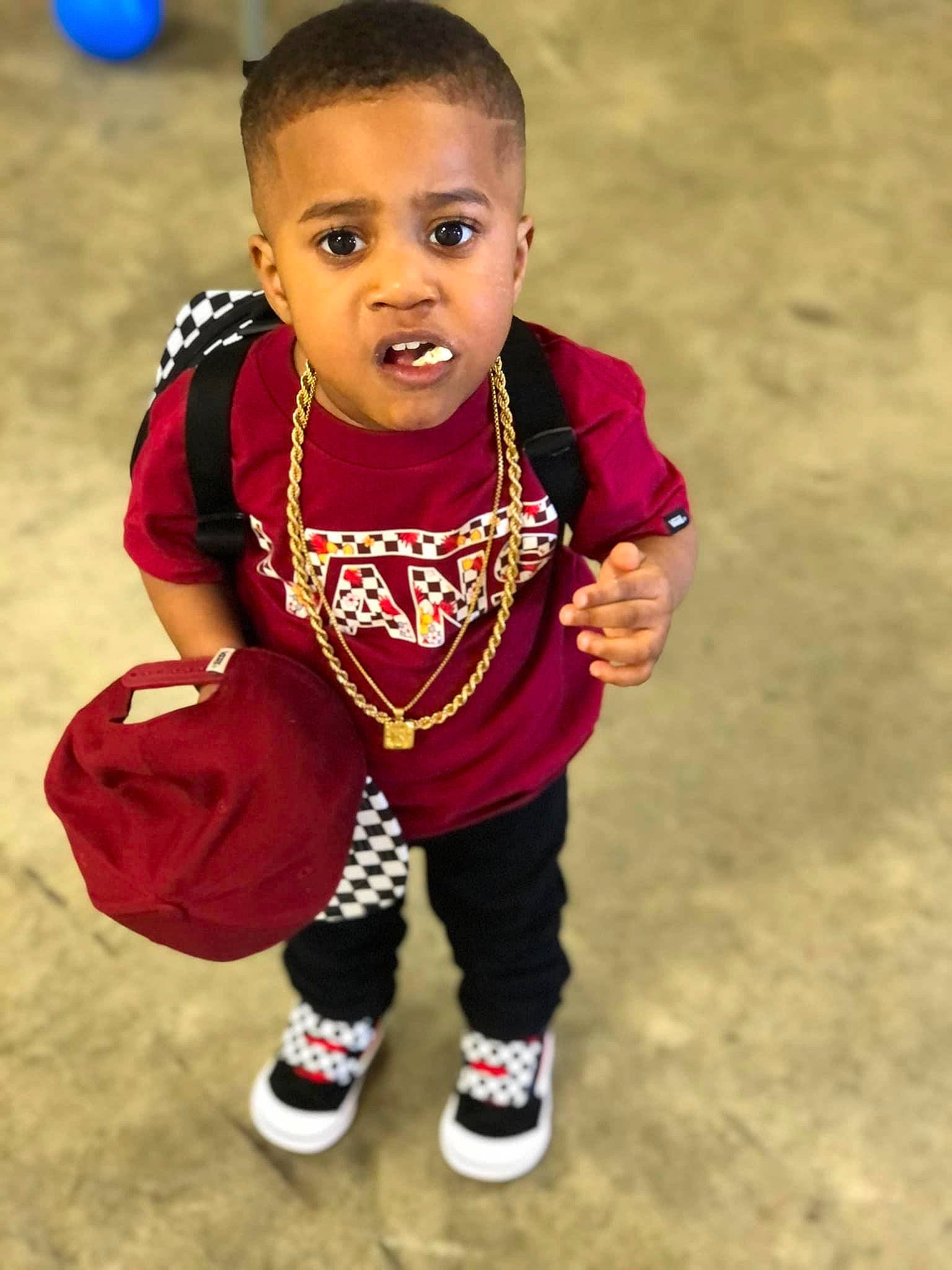 King is registered to the contest to win money with this photo: baby, baby_toddler_clothing, cheek, child, eye, face, flash_photography, flooring, fun, hair, happy, head, human_body, nose, person, sitting, sleeve, sneakers, t_shirt, toddler