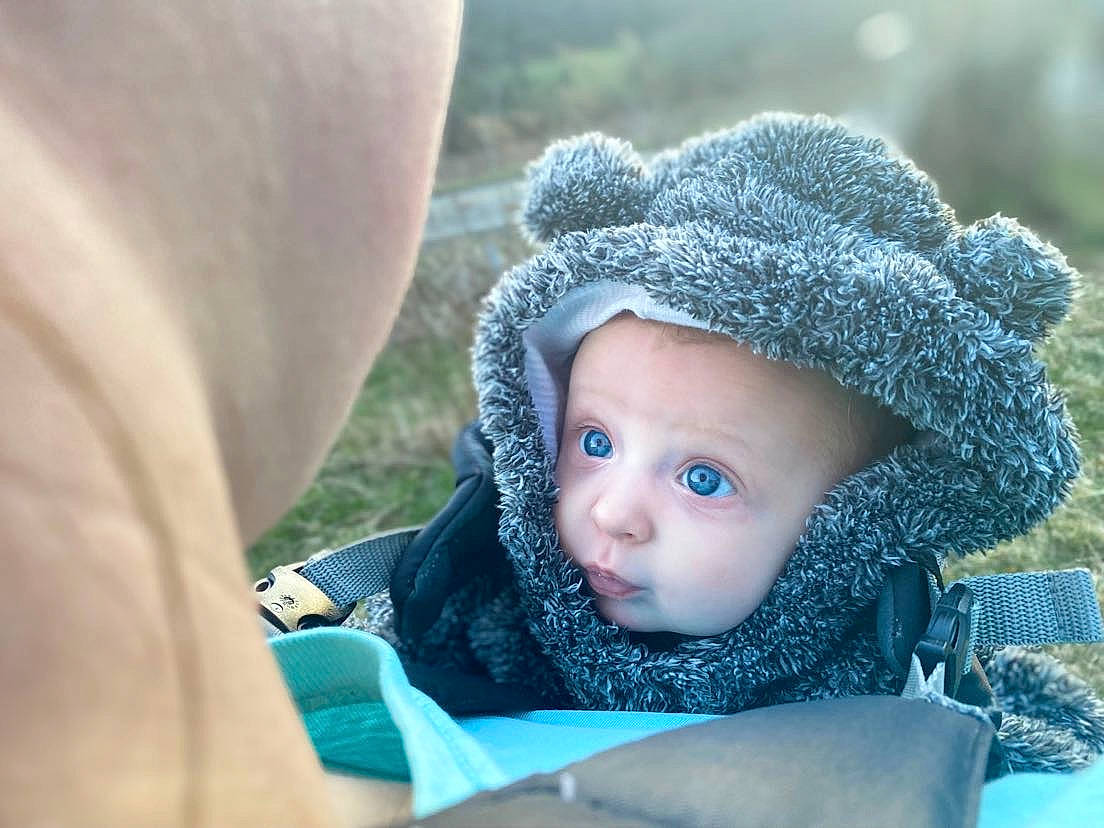 Morgan joined the competition — help win amazing prizes! baby, baby_toddler_clothing, beanie, cap, child, electric_blue, eye, fashion_accessory, freezing, fur, grass, happy, head, human_body, knit_cap, leisure, people_in_nature, person, skin, toddler