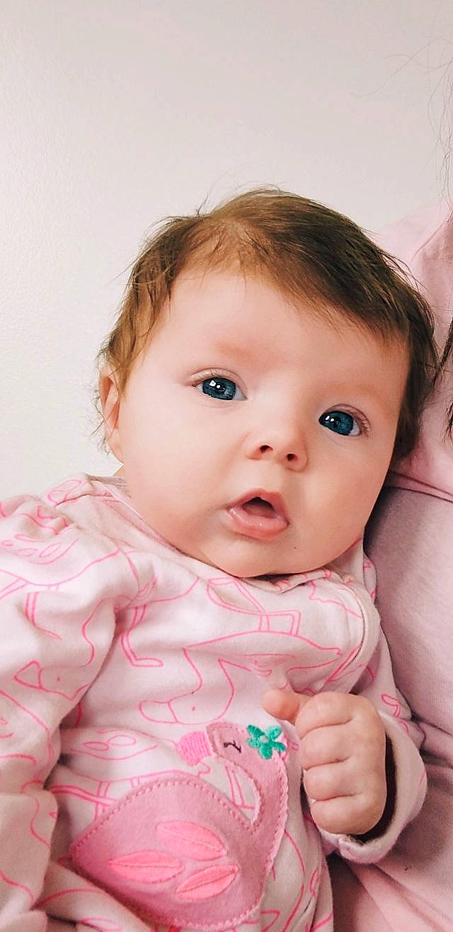 Delilah joined the competition — help win amazing prizes! baby, baby_toddler_clothing, cheek, child, eye, eyebrow, eyelash, finger, flash_photography, gesture, hand, happy, iris, lip, nose, person, pink, skin, sleeve, thumb