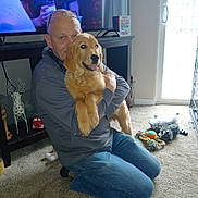 Wilson is registered to the contest to win money with this photo: accessories, adult, animal, canine, clothing, computerhardware, dog, electronics, glasses, hardware, jeans, male, man, monitor, pants, person, pet, puppy, screen, tv