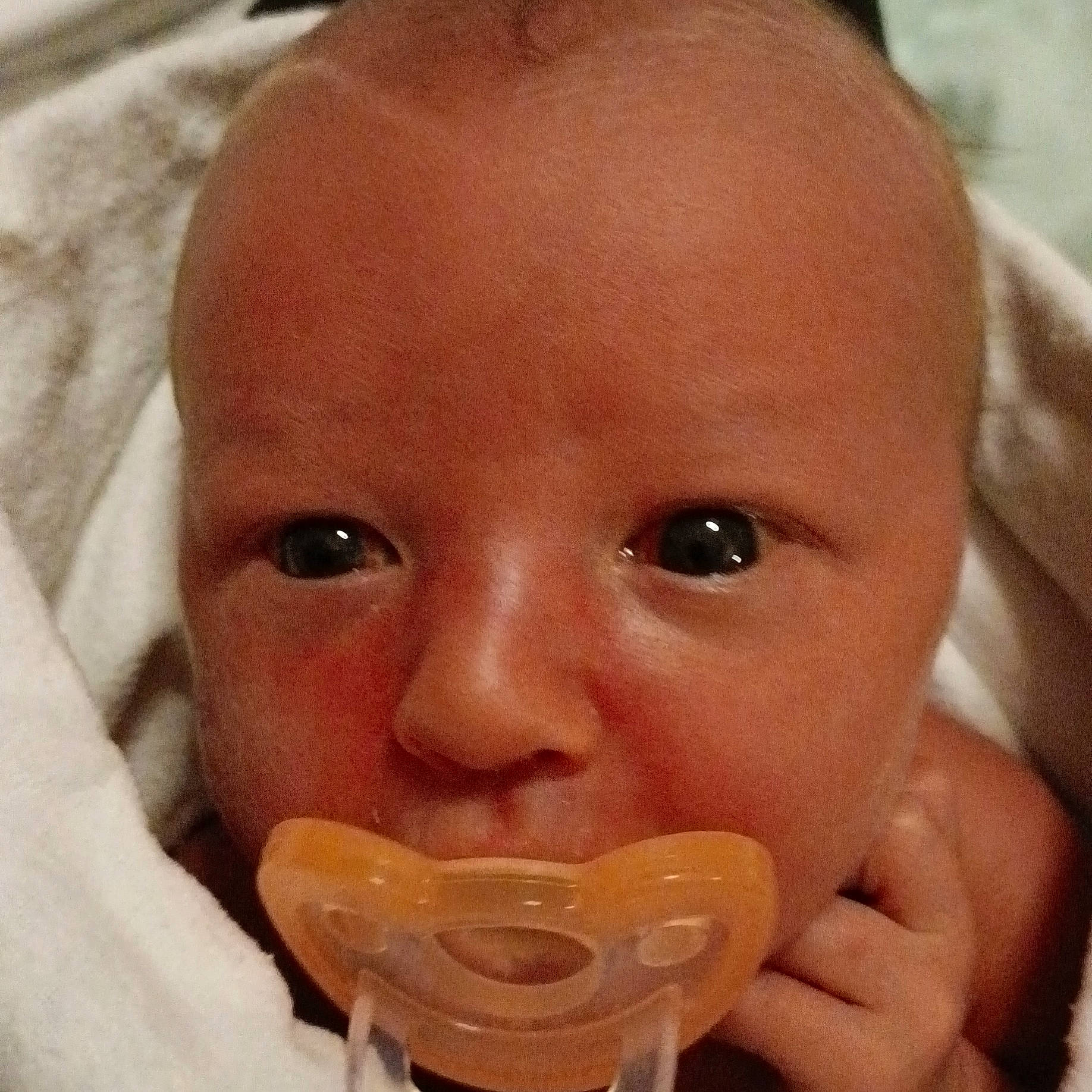 Oliver is registered to the contest to win money with this photo: baby, bathing, cheek, child, chin, close_up, drinkware, ear, eyebrow, eyelash, finger, happy, jaw, lip, mouth, nail, nose, person, skin, thumb