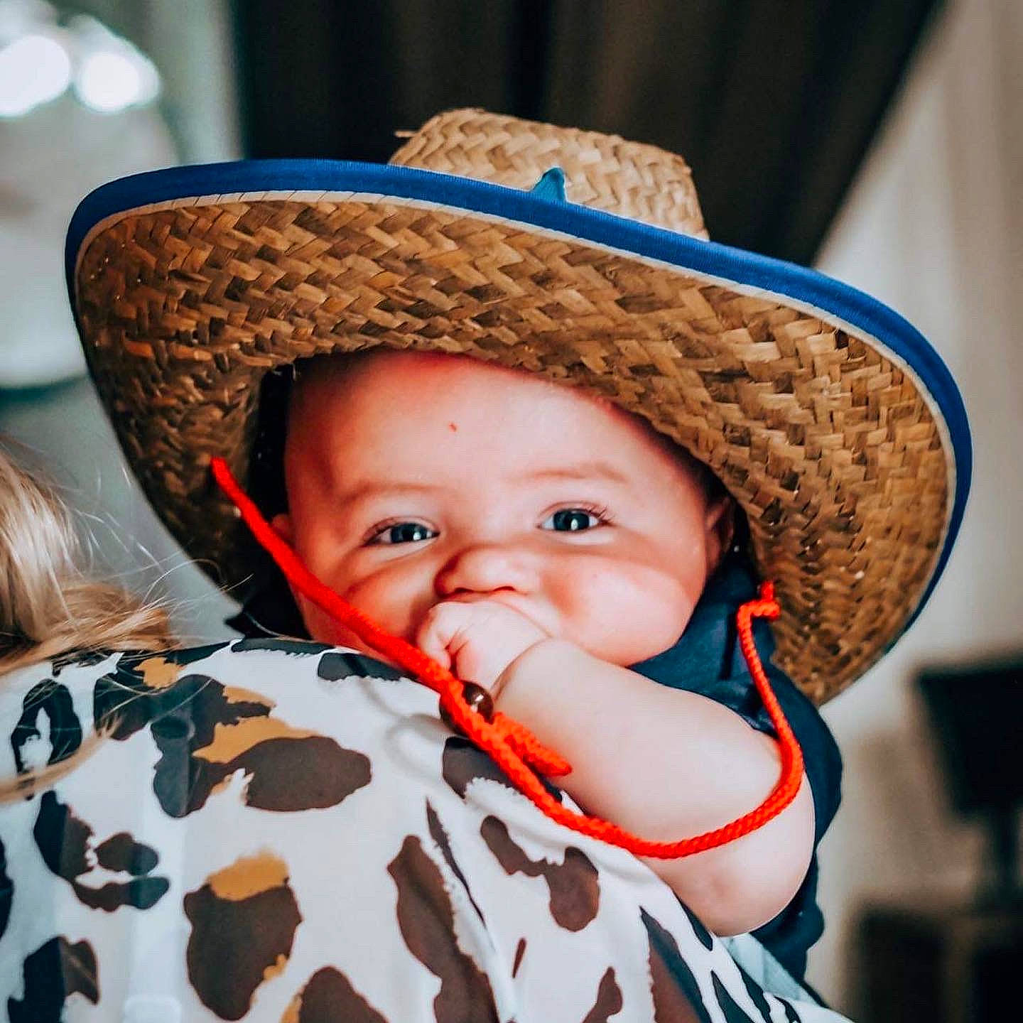 Carson is registered to the contest to win money with this photo: baby, baby_toddler_clothing, cap, child, comfort, costume_hat, eye, face, facial_expression, fedora, happy, hat, headgear, human, lip, organ, person, skin, smile, sun_hat