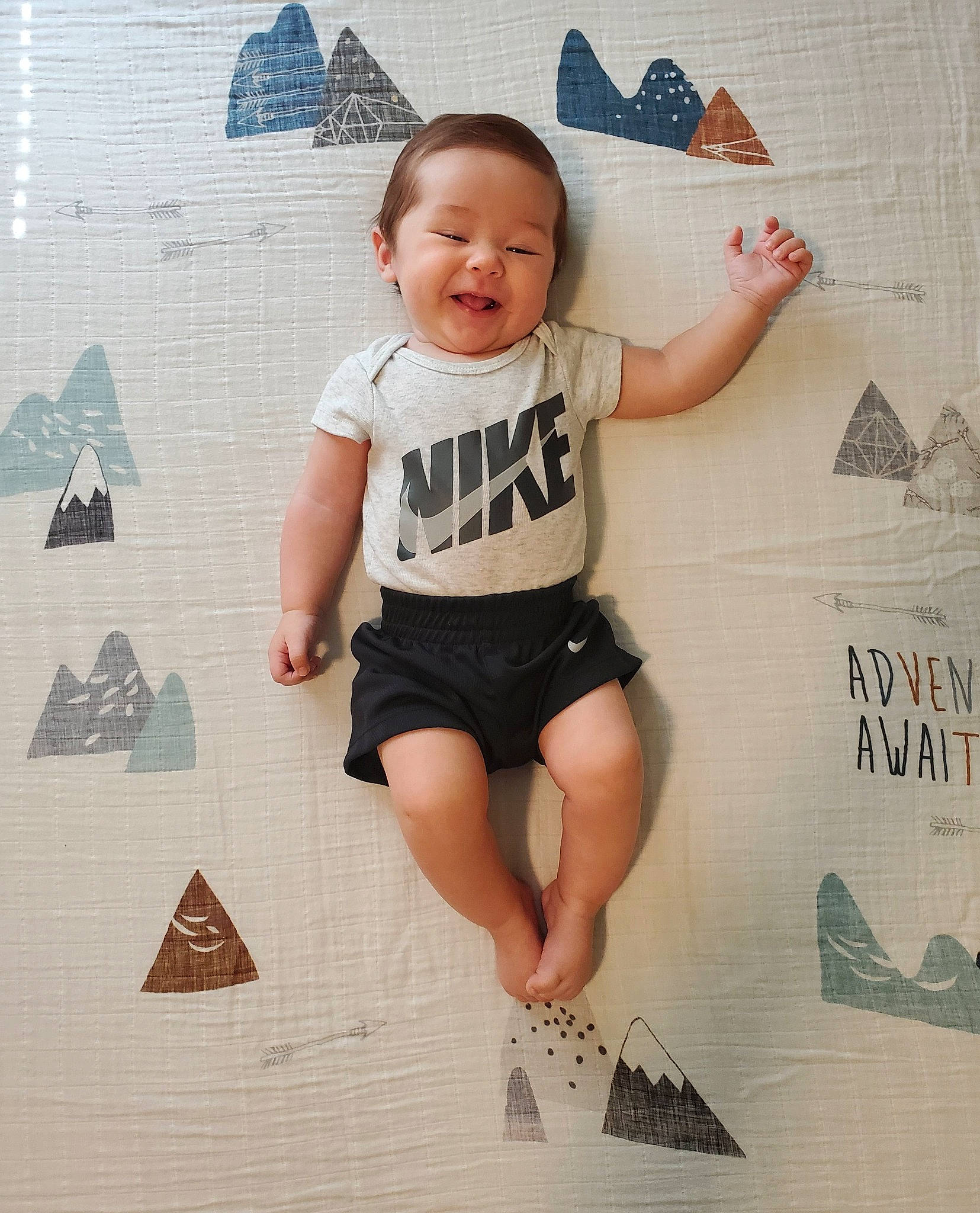 Cameron joined the competition — help win amazing prizes! baby, baby_toddler_clothing, barefoot, child, flooring, font, foot, fun, happy, human_leg, knee, leg, pattern, person, photograph, sitting, sleeve, smile, t_shirt, thigh