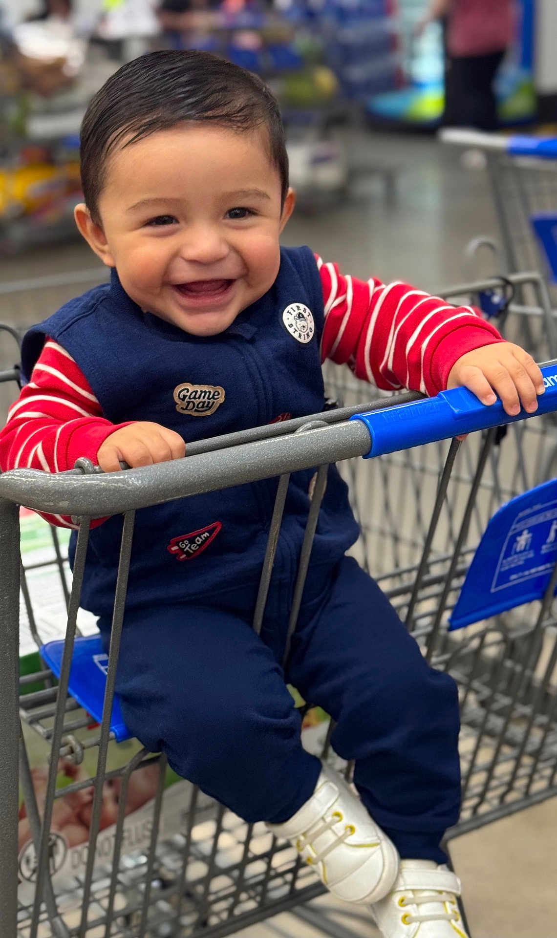 Dashiel Mathias joined the competition — help win amazing prizes! child, toddler, smiling, shopping_cart, clothing, blue, red, striped, white_shoes, happy, indoor, store, aisle, holding, person, baby, cute, face, seat, hands