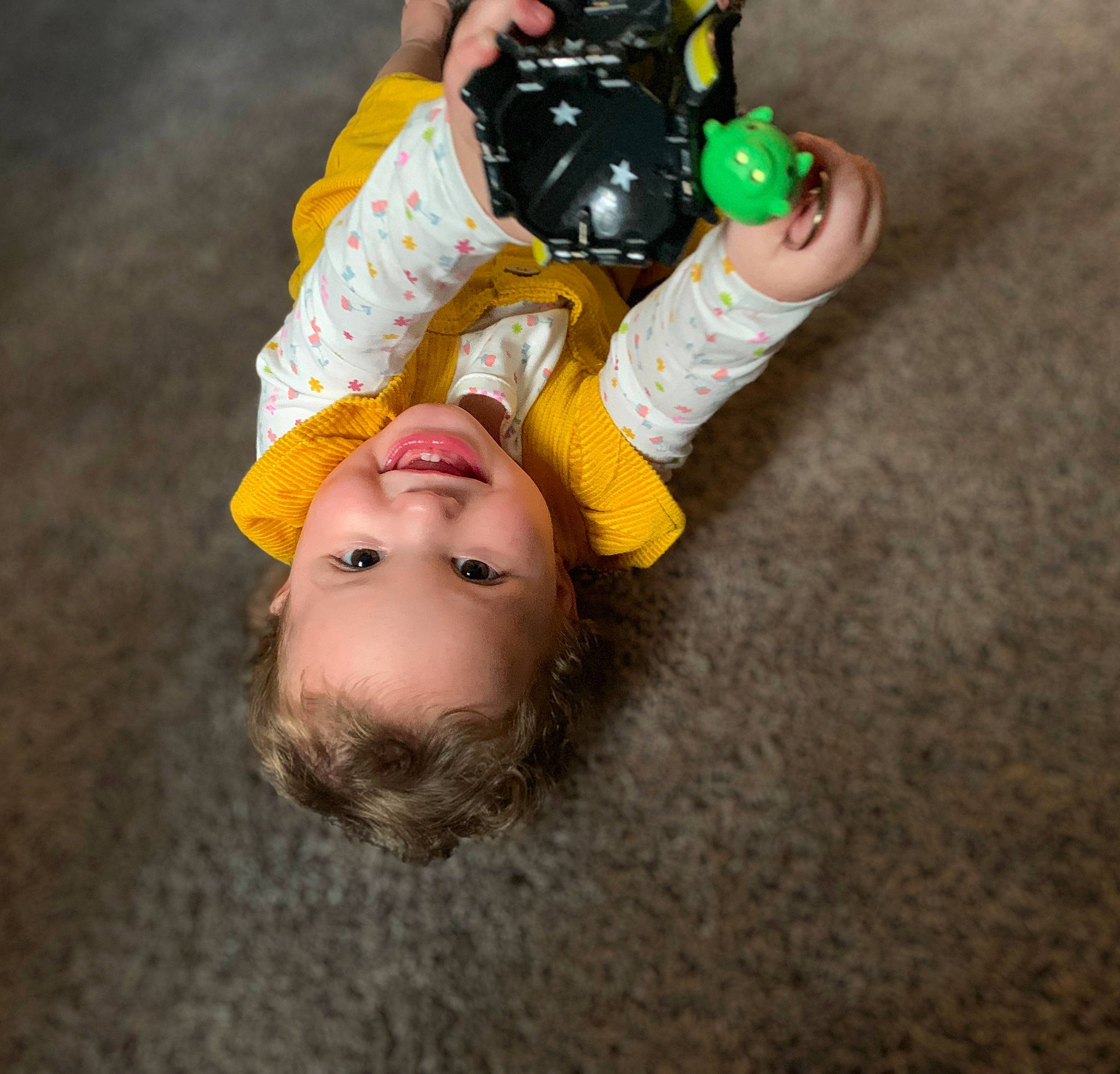 Nyomi is registered to the contest to win money with this photo: baby, baby_toddler_clothing, child, flooring, fun, happy, joy, person, play, smile, toddler, toy