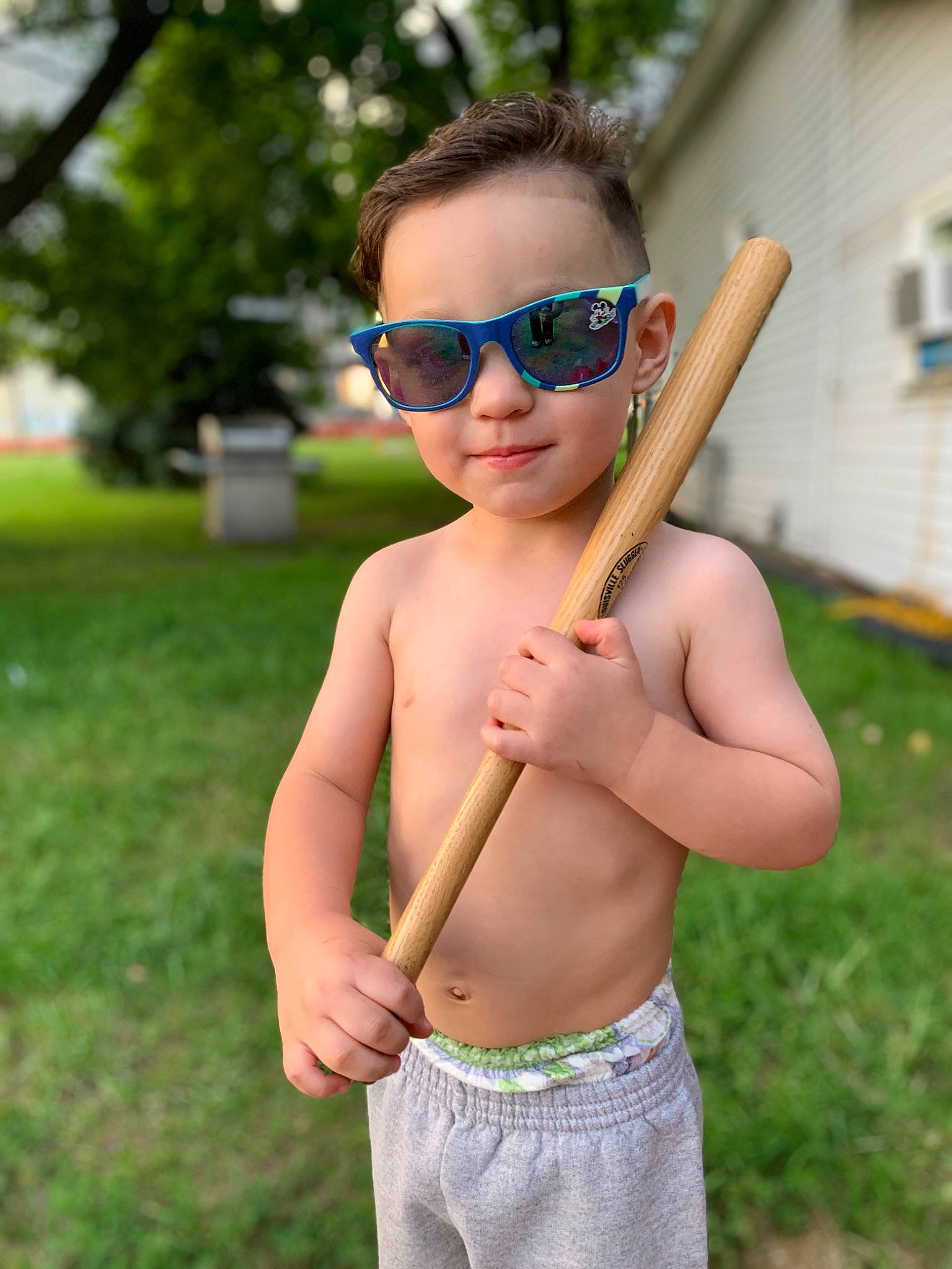 Elliot Ezra joined the competition — help win amazing prizes! arm, chest, eyewear, face, finger, gesture, glasses, grass, hand, happy, head, human_body, people_in_nature, person, plant, shoulder, summer, sunglasses, toddler, tree