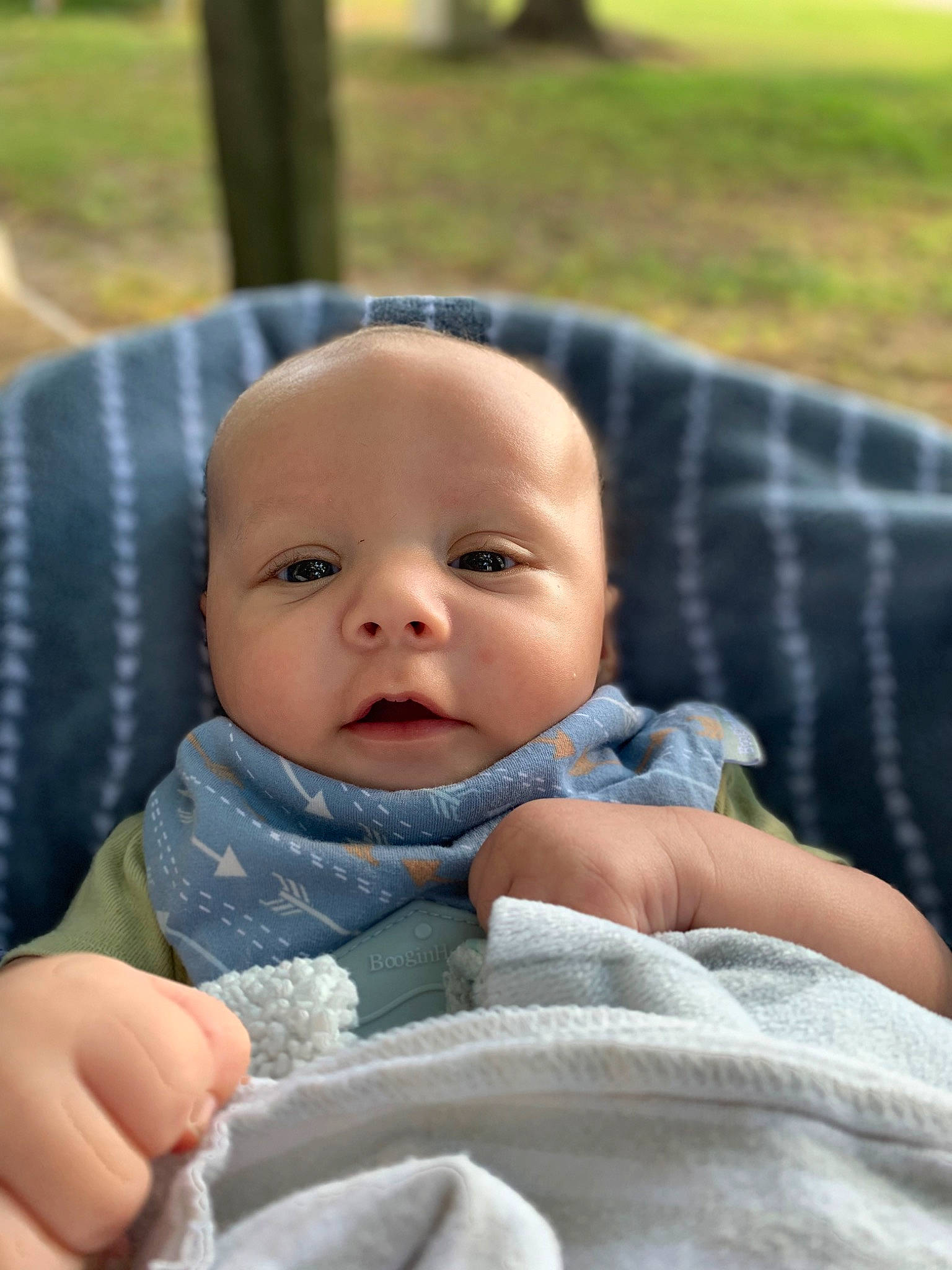 Jiovanni is registered to the contest to win money with this photo: baby, baby_products, baby_toddler_clothing, cheek, child, comfort, eye, finger, grass, happy, head, iris, linens, person, plant, portrait_photography, sitting, skin, sleeve, toddler