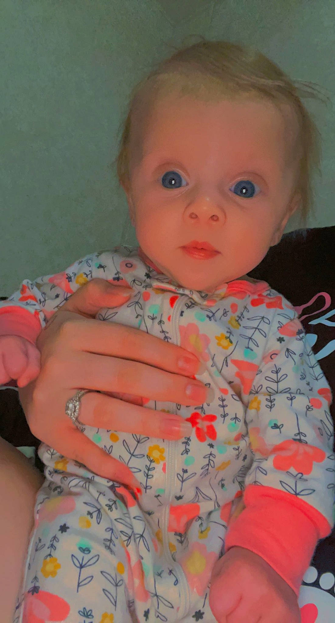 Kaiya is registered to the contest to win money with this photo: baby, baby_toddler_clothing, cheek, child, chin, eye, human_body, iris, linens, lip, mouth, neck, nose, pattern, person, sitting, skin, sleeve, t_shirt, toddler