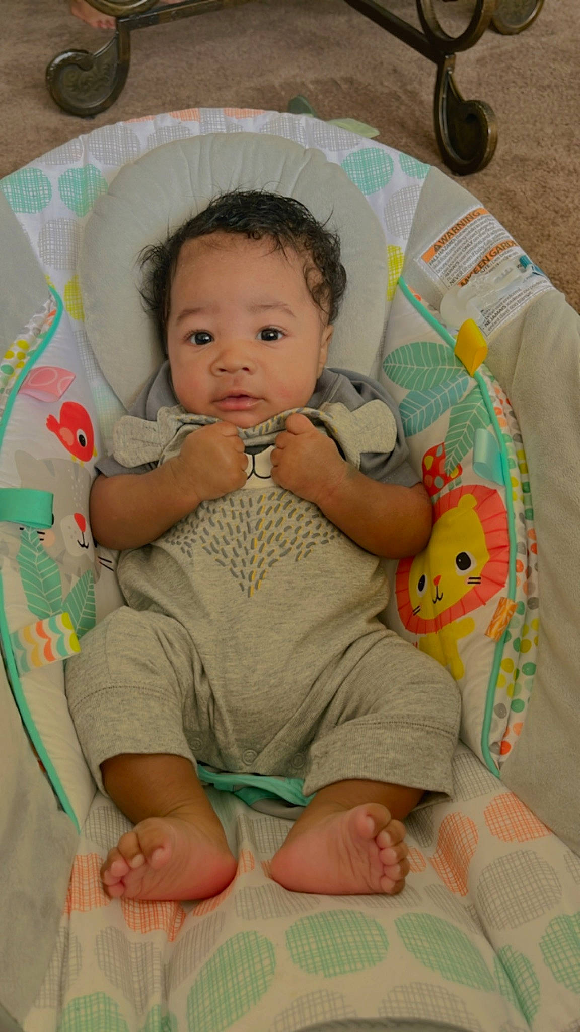 Dakari is registered to the contest to win money with this photo: baby, baby_products, baby_toddler_clothing, cheek, chin, comfort, eye, facial_expression, finger, fun, happy, iris, lap, mouth, nose, person, pink, skin, sleeve, textile