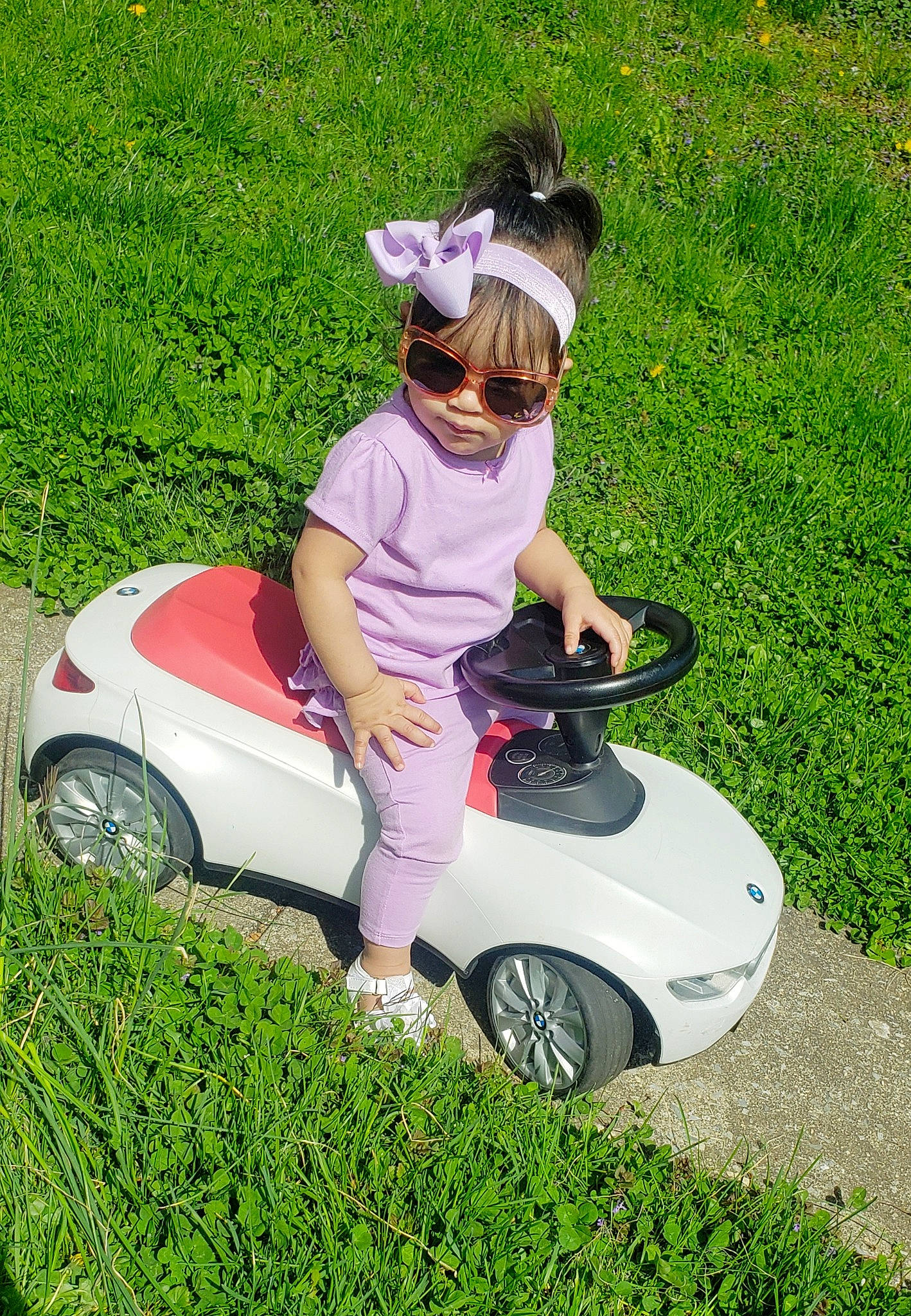 Hailee joined the competition — help win amazing prizes! automotive_design, automotive_exterior, automotive_tire, automotive_wheel_system, bumper, car, fender, grass, happy, hat, hood, lawn, motor_vehicle, person, plant, recreation, rim, tire, vehicle, wheel