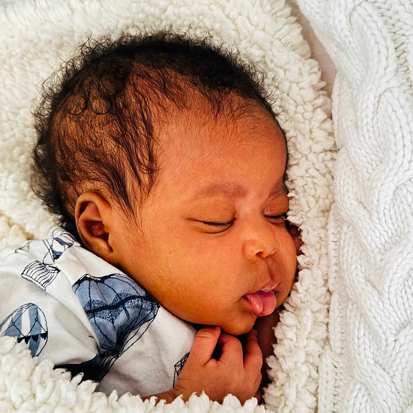 Avana is registered to the contest to win money with this photo: baby, bedtime, blanket, child, clothing, comfort, cozy, curly_hair, cute, face, hand, infant, newborn, peaceful, portrait, resting, sleeping, soft, white, wrapped