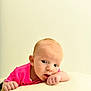 Ronnie Trevor joined the competition — help win amazing prizes! baby, infant, face, pink_clothing, hand, skin, portrait, cute, resting, expression, soft_surface, indoors, child, young, head, curious, looking, small, human, person
