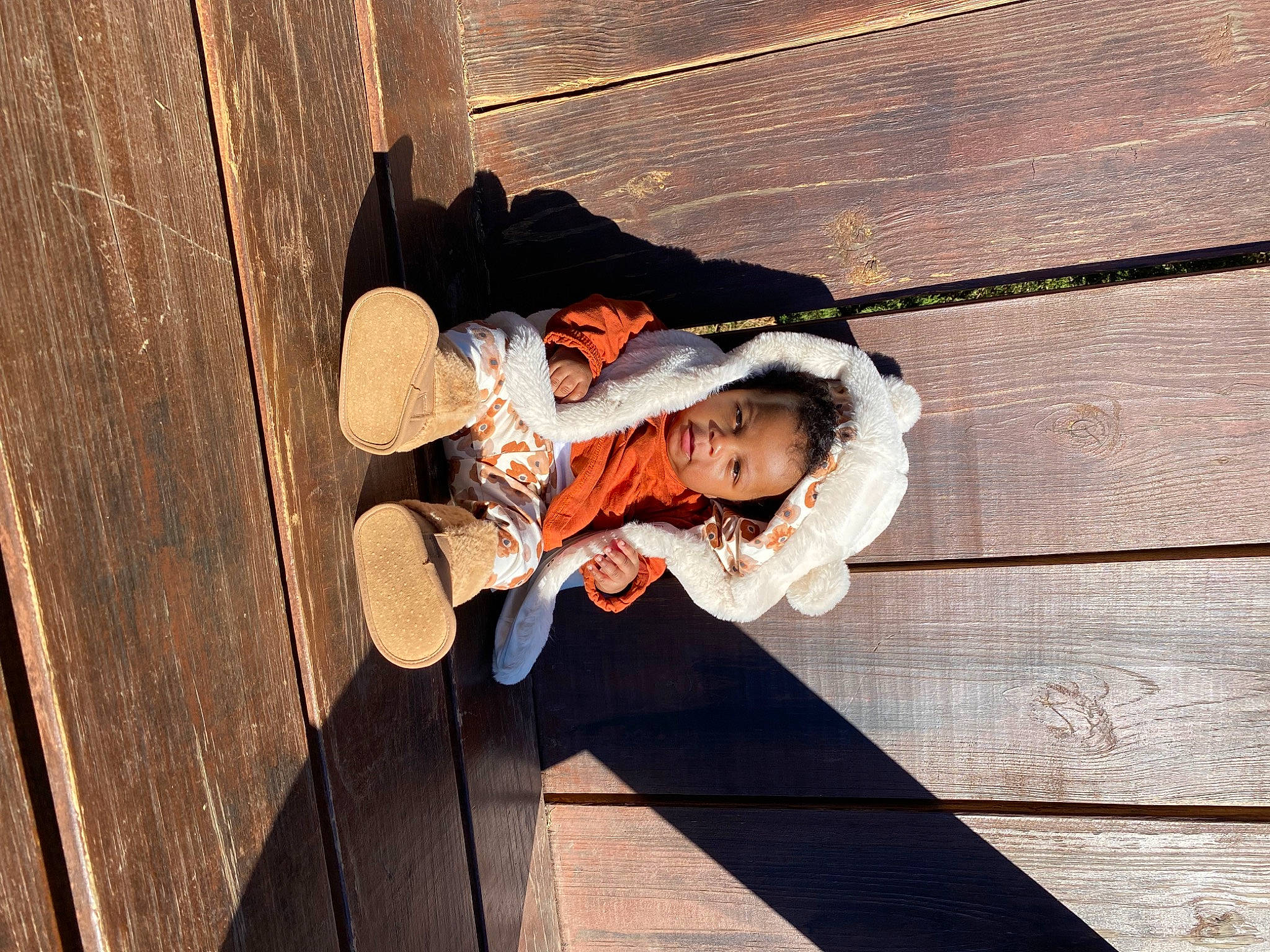Legaci is registered to the contest to win money with this photo: child, floor, flooring, fun, happy, hardwood, leisure, pattern, person, room, shadow, sitting, tints_and_shades, toddler, tree, wood, wood_flooring, wood_stain