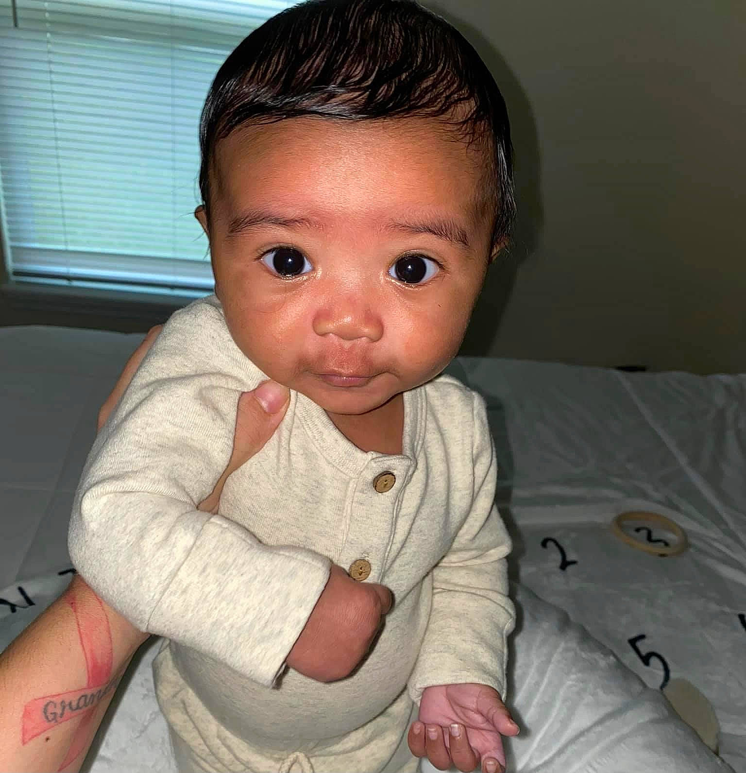 Quade is registered to the contest to win money with this photo: baby, cheek, child, chin, eye, face, finger, forehead, head, iris, lip, nose, person, skin, smile, toddler