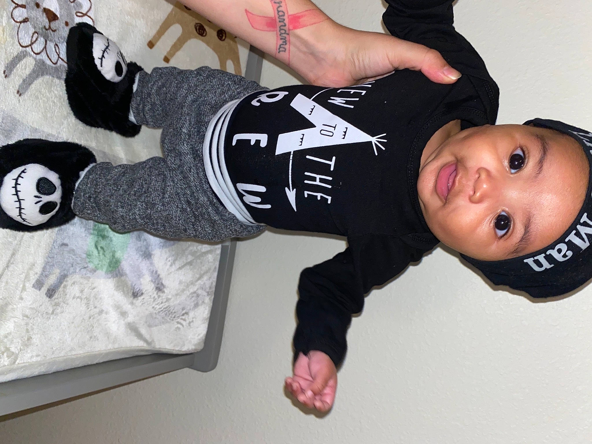 Quade is registered to the contest to win money with this photo: arm, child, cool, fashion_accessory, finger, headwear, joint, person, personal_protective_equipment, photography, sleeve, sportswear, t_shirt, white