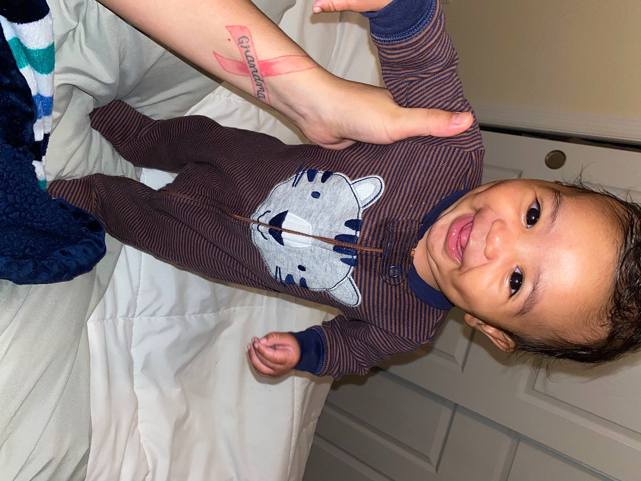 Quade is registered to the contest to win money with this photo: arm, child, joy, leg, mouth, neck, person