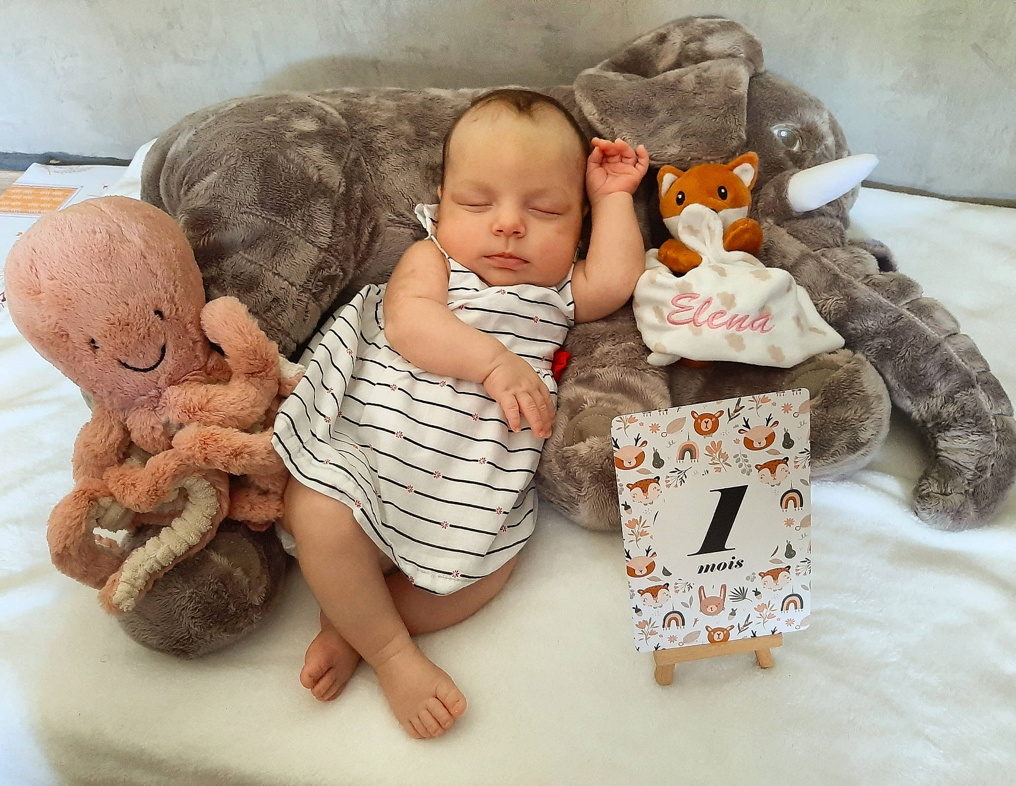 Elena participe au concours pour gagner de l'argent avec cette photo : art, baby, baby_products, baby_sleeping, baby_toddler_clothing, baby_toys, child, comfort, doll, foot, headgear, linens, person, plush, product, sitting, skin, stuffed_toy, textile, toddler