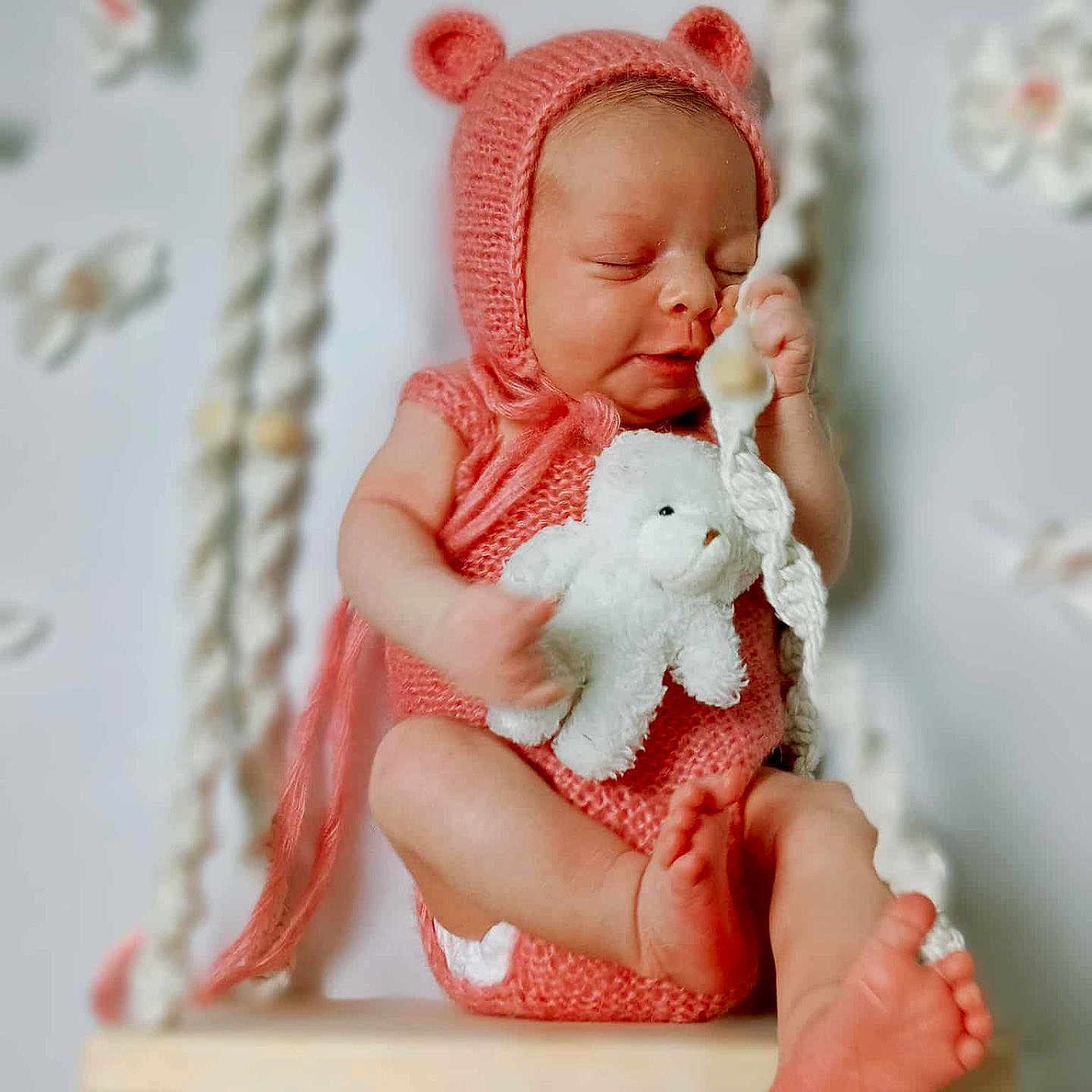 Tanirth is registered to the contest to win money with this photo: adorable, baby, baby_feet, baby_hands, child, cozy, cute, decorations, indoor, infant, knitted_hat, newborn, peaceful, pink_clothing, portrait, sleeping, soft_lighting, swing, teddy_bear, wooden_swing