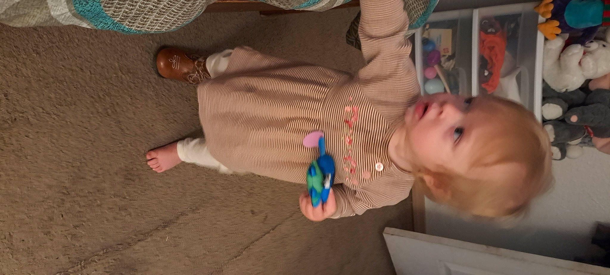 Harlee is registered to the contest to win money with this photo: baby, baby_products, barefoot, child, finger, flooring, foot, fun, hand, human_leg, leg, nail, person, play, sitting, skin, thumb, toddler, toy, vacation