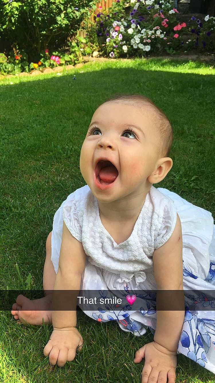 Mia joined the competition — help win amazing prizes! baby, baby_laughing, cheek, child, facial_expression, grass, happy, head, laugh, lawn, mouth, nose, person, sitting, smile, toddler, tongue