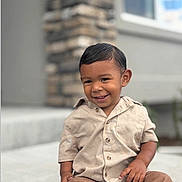 Noah joined the competition — help win amazing prizes! background_blur, beige_shirt, brown_pants, casual_clothing, child, concrete, cute, daylight, face, hair, happy, outdoor, person, portrait, short_sleeves, sitting, smiling, stone_wall, toddler, window