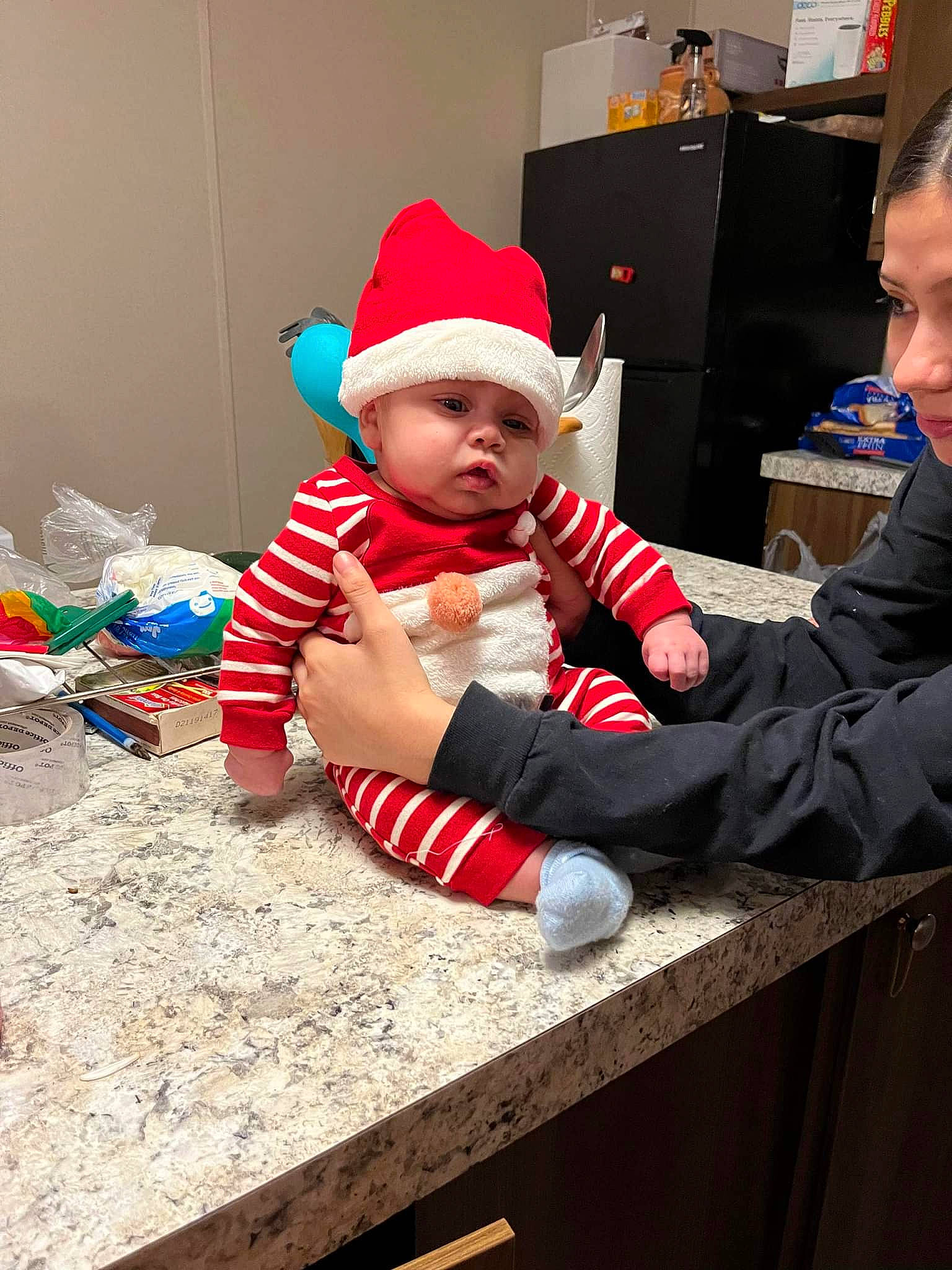 Lailo'Nie joined the competition — help win amazing prizes! baby, baby_toddler_clothing, cap, carmine, child, christmas, christmas_decoration, christmas_eve, costume_hat, event, fictional_character, fun, hat, headwear, holiday, lap, person, room, santa_claus, sitting