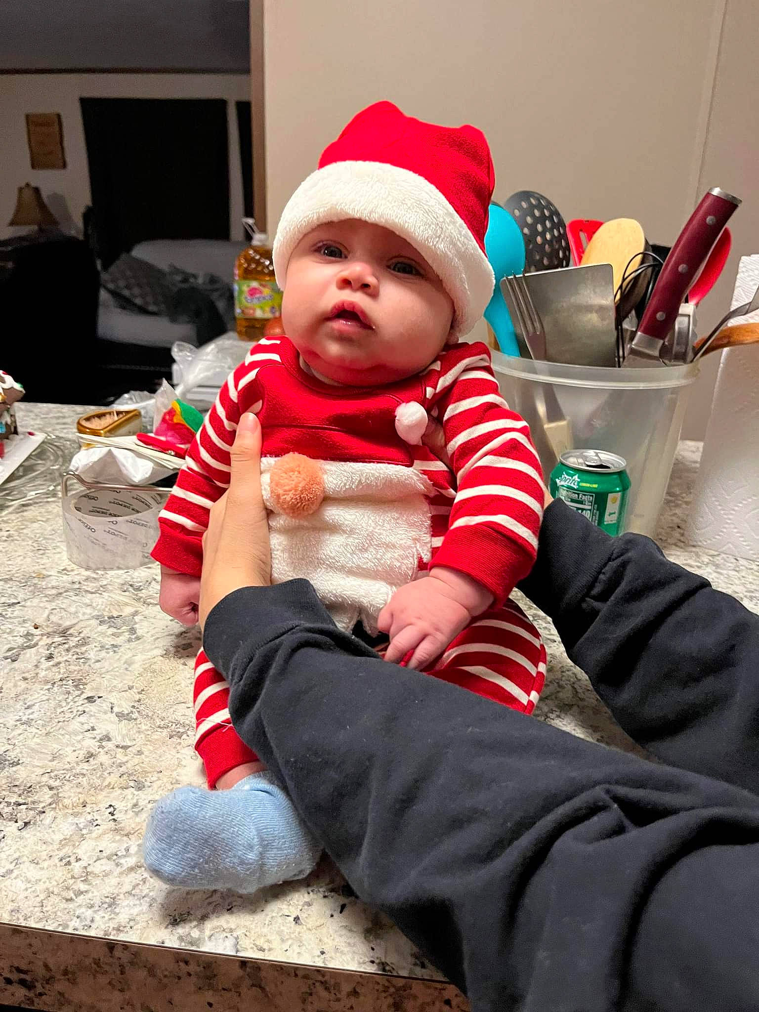 Lailo'Nie is registered to the contest to win money with this photo: baby, baby_toddler_clothing, cap, carmine, child, christmas, christmas_eve, comfort, costume_hat, event, happy, hat, headgear, headwear, holiday, lap, person, red, santa_claus, sitting