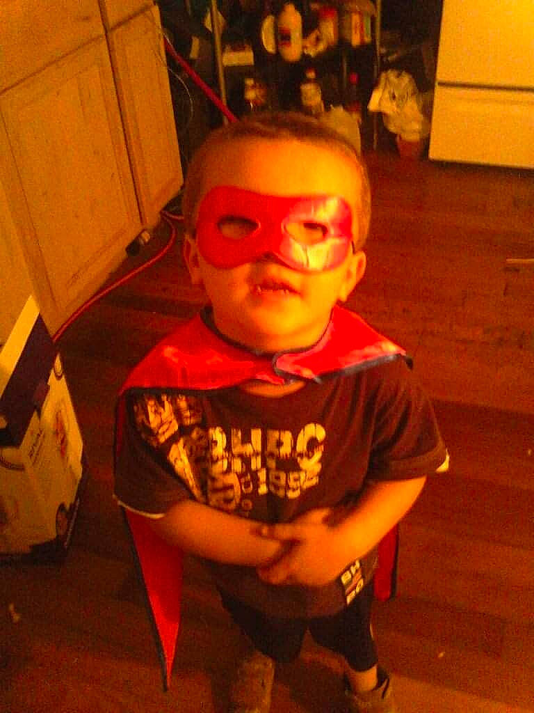 Timothy is registered to the contest to win money with this photo: baby_toddler_clothing, cabinetry, carmine, eyewear, floor, flooring, fun, goggles, hardwood, head, orange, person, personal_protective_equipment, room, selfie, sleeve, sunglasses, t_shirt, toddler, vision_care