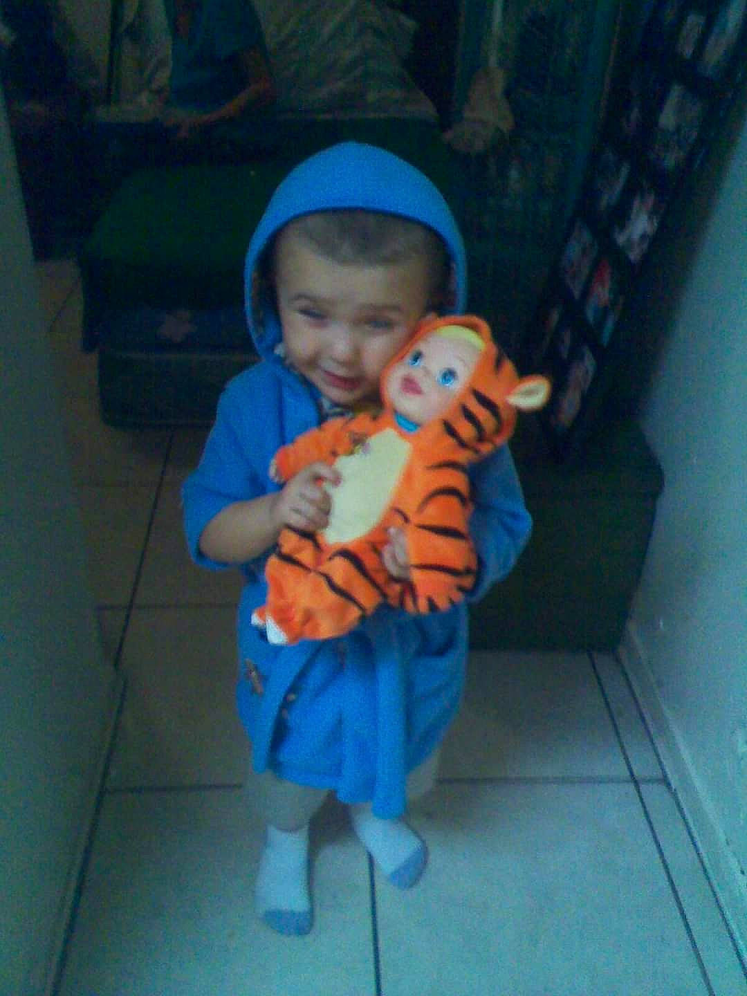 Timothy joined the competition — help win amazing prizes! baby, baby_products, baby_toddler_clothing, baseball_cap, child, electric_blue, flooring, fun, hat, leisure, person, play, room, sitting, standing, stuffed_toy, t_shirt, thumb, toddler, toy