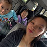 car_interior, child, children, young_woman, smile, seat, car_seat, casual_clothing, daylight, family, portrait, happy, people, window, seatbelt, inside_vehicle, hair, face, toddler, sibling