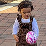 Lusiana is registered to the contest to win money with this photo: toddler, child, ball, leopard_print, dress, headband, curly_hair, white_shirt, sneakers, outdoor, sidewalk, greenery, sunlight, playing, walking, young_child, casual_clothing, daylight, person, motion