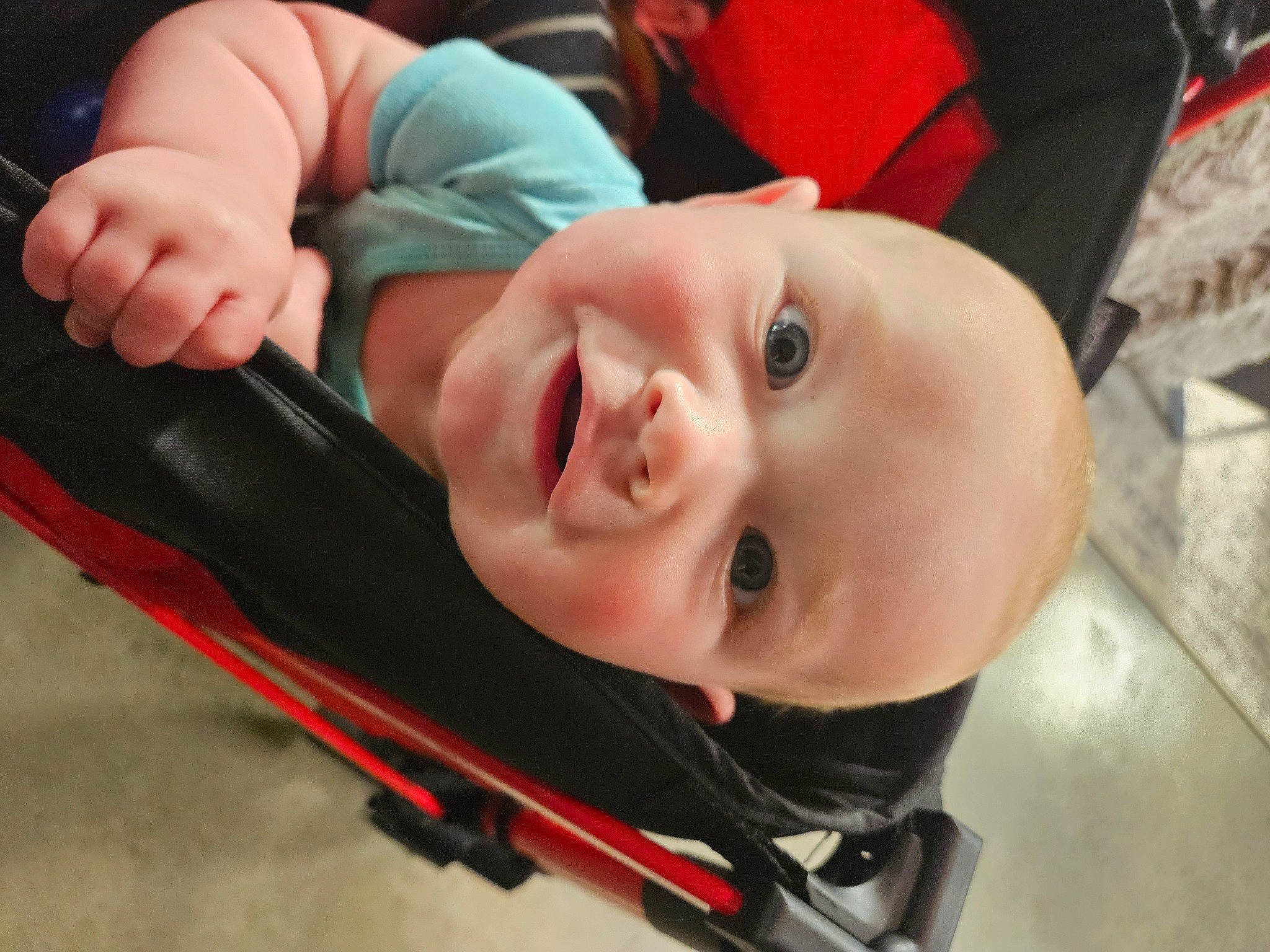 Ryder is registered to the contest to win money with this photo: baby, baby_carriage, baby_laughing, baby_products, baby_toddler_clothing, cheek, child, comfort, event, eye, facial_expression, fun, happy, hat, lip, mouth, person, personal_protective_equipment, skin, smile