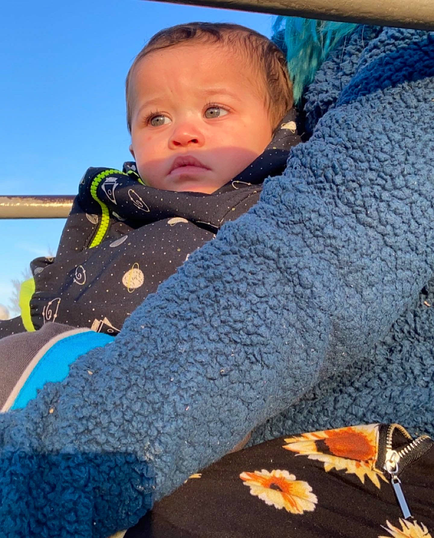 Davon joined the competition — help win amazing prizes! baby, baby_products, baby_toddler_clothing, bedding, child, comfort, couch, flooring, fur, grass, insect, linens, pattern, person, sitting, sky, textile, toddler, vertebrate, wool